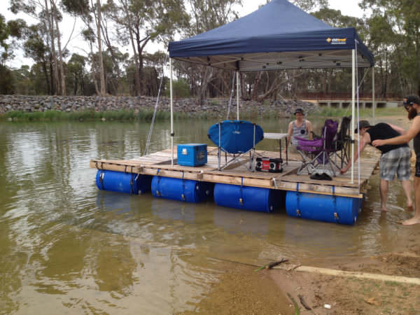 diy: portable pontoon using old pallets and old blue drums