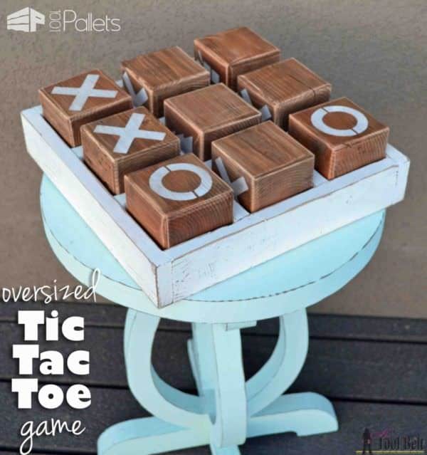 Kid-friendly Pallet Projects like this tic-tac-toe game can be made entirely by the kids (with supervision). You cut the blocks loose, and they can sand and paint them while you enjoy an adult beverage in the shade!