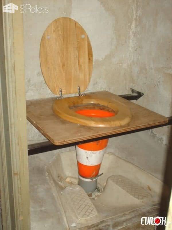 Not everyone was raised to use stand-up toilets. Someone made a Weird Wood project by using a traffic cone as a connecting pipe from a makeshift seat of upcycled wood to the opening in a "European" toilet where you stand and squat.