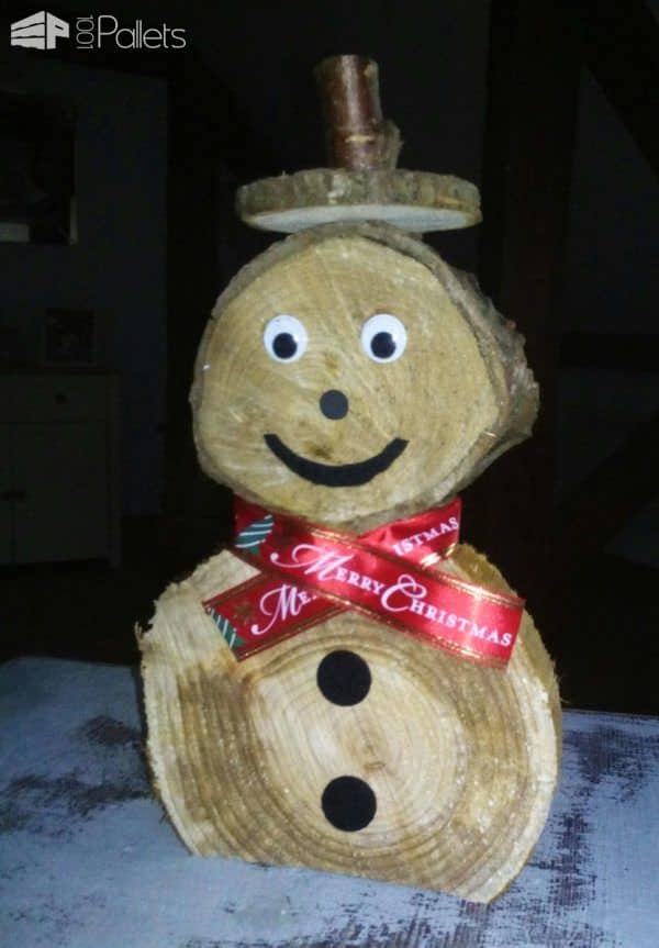 Use slices of branches to create your own version of our Pallet Snowman Ideas.