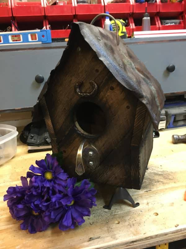 This Barn Style Birdhouse features a bent spoon as a perch.