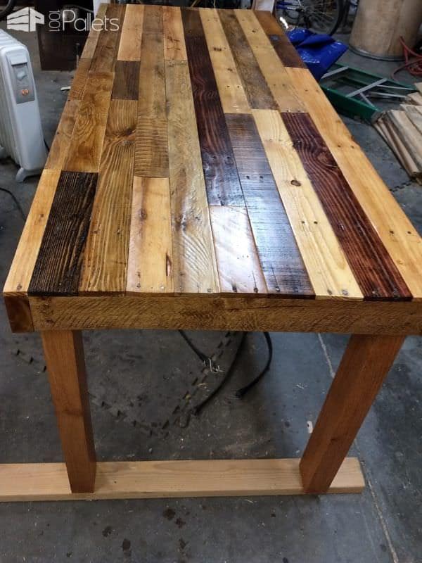 I planed the wood but kept some of the old sawmill marks on this Pallet Dining Table.