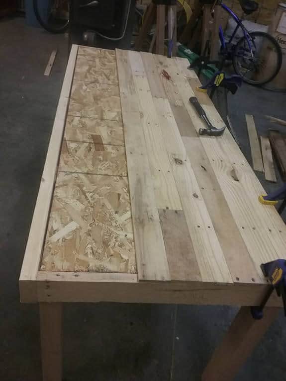 This Pallet Dining Table has a 1/2" OSB plywood base.