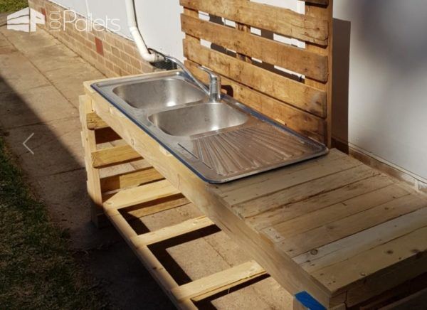 This Pallet Kid's Kitchen features a working sink.