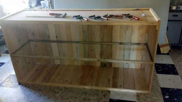 I began covering the exterior of the Decorative Pallet Bar with more pallet wood.