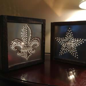 Punched Tin Pallet Lights make great gifts, and are good for indoor and outdoor living. If you make these for an outdoor space, be sure to use appropriate lighting kits, or opt for led-candles/regular candles instead.